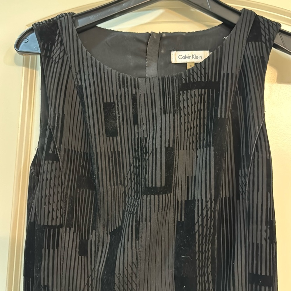 Calvin Klein black dress. Beautiful fabric with great detail.